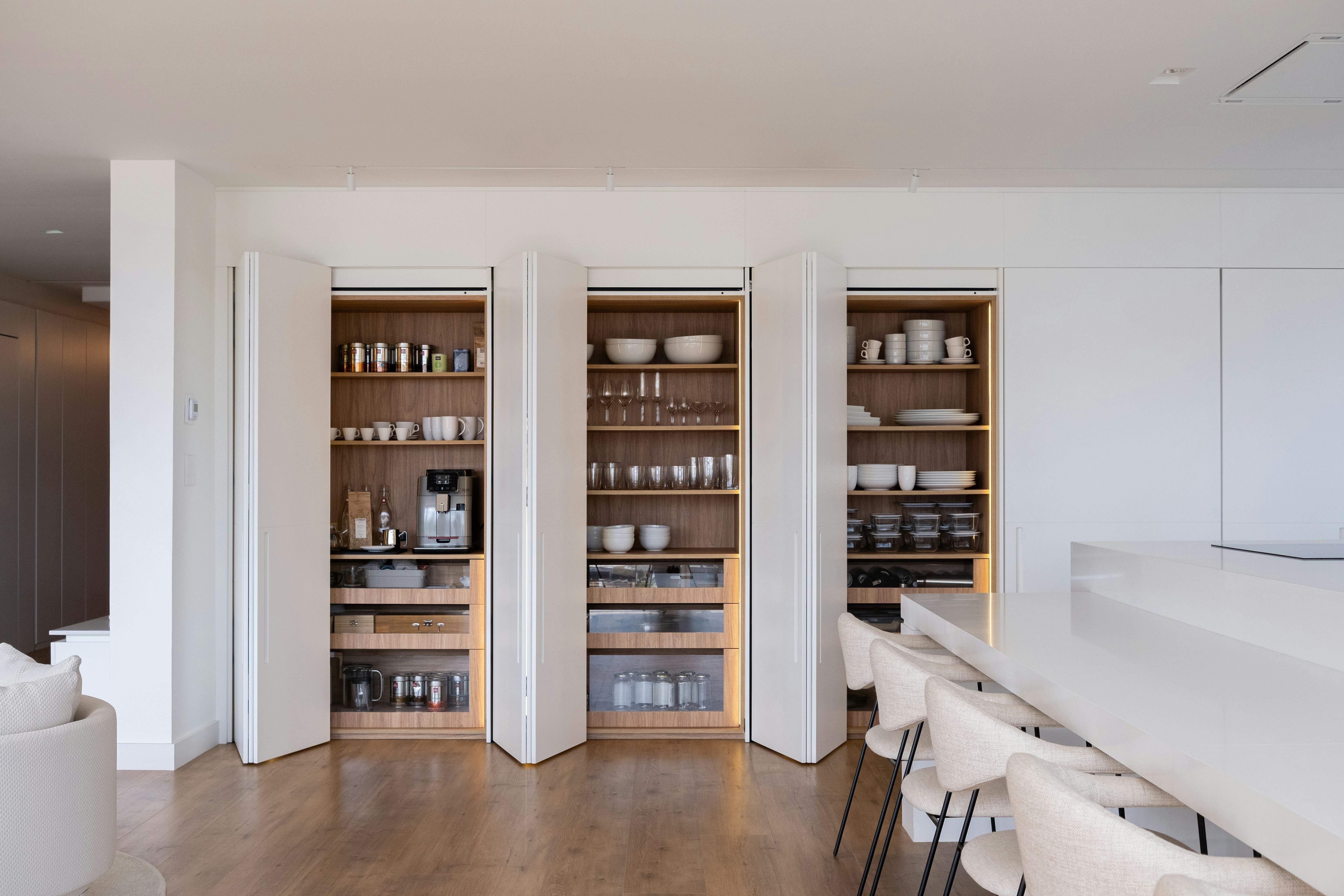 Beautifully organized home pantry with labeled containers and tidy shelves